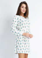 Short turquoise dress with open flower motif